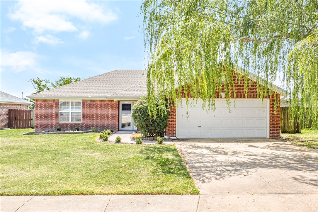 Charming 3 Bed 2 bath home in Centerton! Perfect starter home! Renovated with new paint and flooring throughout, new roof, new hot water heater and is move in ready! Spacious foyer entry welcomes you into the large living room with gas fireplace and backyard views. The eat in kitchen offers great workspace and open to eating area and backyard, perfect for entertaining. The large primary bedroom has attached bath with his and her closets and shower. The split floorplan layout has two great sized guest bedrooms and a guest bath on the other side of the home. Backyard is a great outdoor living space, with large patio and pergola covering, firepit, and privacy fencing. Welcome home!