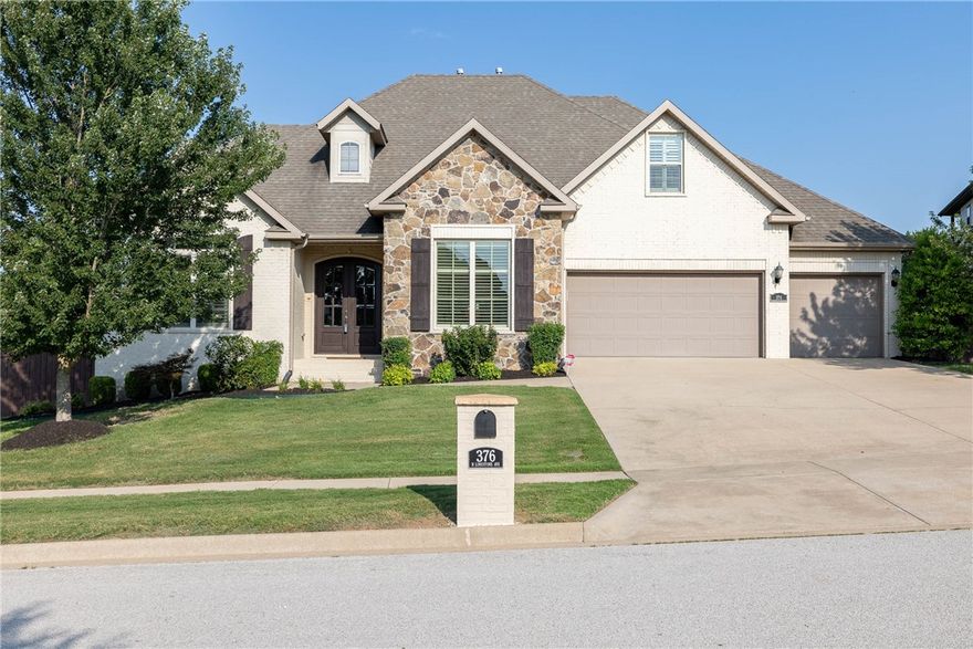 Exquisite home in East Fayetteville! Nestled on a corner lot in the desirable Stone Mountain Subdivision, this stunning residence offers luxury and comfort in every detail. The home features an open floor plan with beautiful hardwood flooring throughout both levels. The eat-in kitchen offers beautiful views of the private backyard, granite countertops, a drop-in microwave, and a gas cooktop with a pot filler, making entertaining a breeze. The main level includes an office with built-ins, a private en-suite bath, and a walk-in closet. Living room has a beautiful stone fireplace and plenty of natural lighting. The primary bedroom includes a seating area, a large bath, and a spacious walk-in closet/dressing room. Upstairs, there is a large bonus room/4th bedroom, along with two full bathrooms and two additional bedrooms with ample storage. The home also features a covered patio, central vac, and a 3-car garage with an EV plug-in. Don't miss this well-kept, immaculate home!