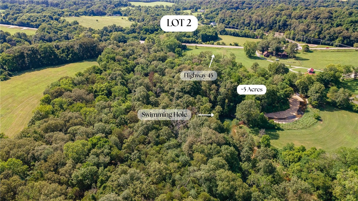 Nestled amongst the creek bed, this 5 acre parcel of land is perfectly suited for an adorable cottage! Looking to scale down or have a little getaway place for the weekends? You would thoroughly enjoy this site! Electricity and gas are available. Will need well water. Drive 15 minutes to town for all of the modern amenities at the intersection of Crossover and Mission in East Fayetteville.