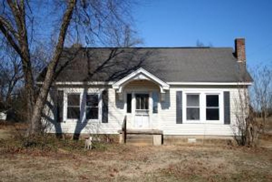 3 bedroom 1 bath home on 1 acre of land. In need of repairs, but has lots of potential. Some hard wood flooring, and living room has a place for a wood burning insert. 3rd bedroom is located upstairs.