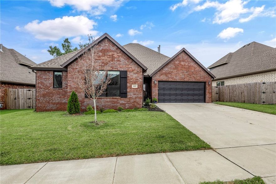 Step inside this well-maintained 3-bedroom home boasting a HUGE open-concept floor plan on the main level—perfect for entertaining, holiday gatherings, and everyday living. The spacious kitchen is the heart of the home, featuring a MASSIVE walk-in pantry, granite island, gas range, and stainless steel appliances. The living room flows seamlessly with high ceilings and abundant natural light, while the private covered patio and fenced yard create an inviting outdoor retreat. The main-level primary suite offers a spa-like bath with tiled shower and oversized walk-in closet. Upstairs, secondary bedrooms share a full bath and generous closet space. This home offers comfort and value in a neighborhood that’s still growing—without the wait of new construction. Conveniently located near XNA and the Walmart Distribution Center.