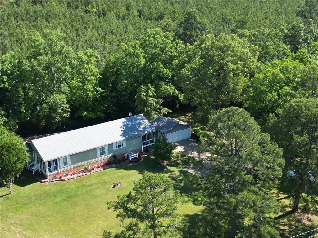 Discover country living at its finest with this charming 3-bedroom, 2-bath home offering 1,796 square feet of beautifully detailed living space. Nestled on just under an acre (.96 acres), this inviting home blends comfort and character with modern convenience.
Enjoy peaceful mornings and relaxing evenings from not one, but two gorgeous screened-in porches—perfect for entertaining or simply taking in the surrounding natural beauty. Inside, you’ll find thoughtful finishes throughout, creating a warm and welcoming atmosphere.
The spacious 2-car garage provides ample storage, while the serene koi pond adds a tranquil touch to the property. Whether you're enjoying a quiet moment outdoors or cozying up inside, this home offers the perfect retreat from the hustle and bustle.
If you're looking for a place where comfort meets country charm, this is the one to see!
