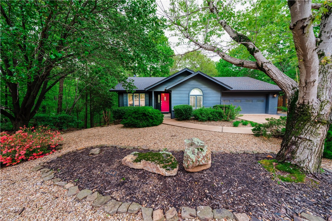 Welcome to the tranquility of "Backyard Oasis", a fully renovated mid-century modern retreat nestled on an oversized lot. Thoughtfully designed to combine timeless style, this home offers an open-concept living and dining area. A beautifully updated kitchen boasts stainless steel appliances and ample counter space. The serene primary suite is filled with natural light and is complemented by a refreshing en-suite bathroom. Located off the main living area, the cozy and bright sunroom provides flexibility for an office or a bonus space. Discover equally inviting spaces in the expansive wooded backyard complete with a grill, fire pit, and string lightingāperfect for both relaxation and entertaining. This property provides an ideal fusion of mid-century modern charm with contemporary comforts. Experience a peaceful escape immersed in nature, while still enjoying all of the amenities Bella Vista has to offer. Please note that the home is on a 2 bedroom septic system.