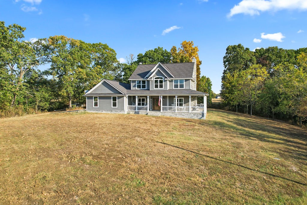 Nestled next to Pea Ridge National Military Park & the historic Heritage Trail, this stunning home offers breathtaking views from the wrap-around porch. Set on a hill, it features a unique tandem garage with a spacious workshop plus an oversized 2-car garage for plenty of storage. Inside, the open-concept kitchen & living area seamlessly blend comfort and style, with a separate dining room that can serve as a 2nd living space/office. The luxurious primary bath features dual vanities and a fully-tiled stand-up shower. Elegant hardwood flooring flows throughout, and the kitchen has Brazilian granite countertops, ss appliances, gas range, and a reclaimed wood prep island with bar seating. Additional highlights include no carpet, 2 heating/AC units, a custom-built stairway, and multiple ceiling fans on the porch. Fully wired for security, sound, and Starlink, plus a backup generator hook-up. Donāt miss this tranquil retreat!