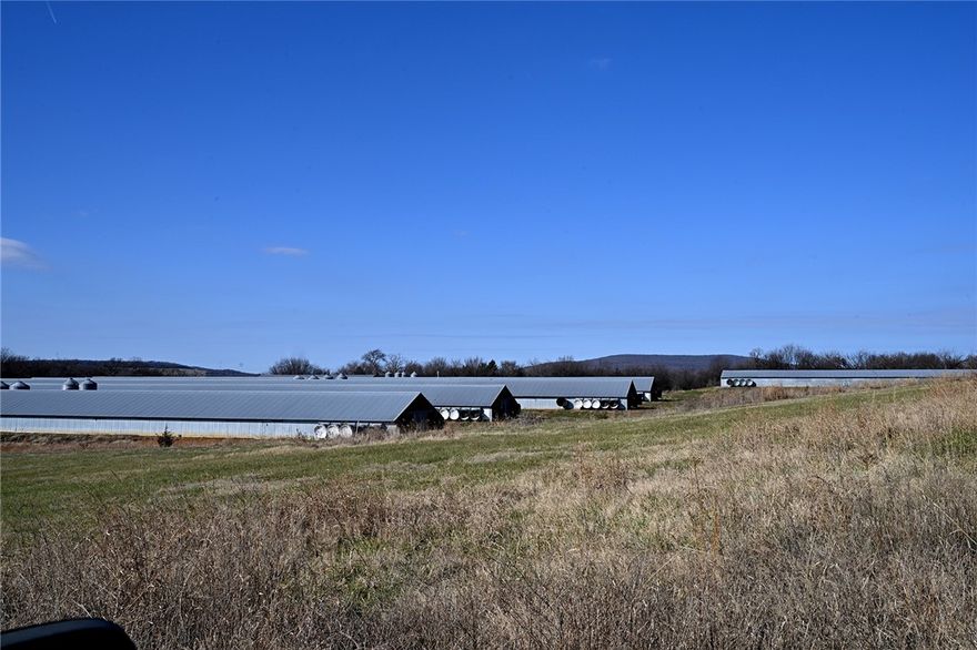 **** BIO-SECURE - DO NOT ENTER WITHOUT PERMISSION / APPOINTMENT ONLY **** If you are looking for an opportunity to purchase a broiler operation with large SF here is one to consider! Priced to sell.  (3) 1995 built 32x500's (steel truss with drop ceilings) choretime, (6) 2005 built 43x500's (wood truss with drop ceiling), spring fed water system with rural water, water storage tanks, 5/5k gallons, controllers are Rodem wireless/alarms, propane tanks are owned, new waterline, 2 back-up generators 150hp and 100hp auto-start. TWO residential dwellings (live in one and have a farm hand), litter shed, compost, storage-lean-to for equipment. Equipment with negotiated contract could include (2) windrow(s), Tractor, tiller, leveler, sprayer (needs pump replaced), City/rural water for dwellings.Gross $500k - big bird - gas allowance *both houses need some TLC (livable but not perfect). GORGEOUS VIEWS AND OPTIONS FOR HAY GROUND/PASTURE!