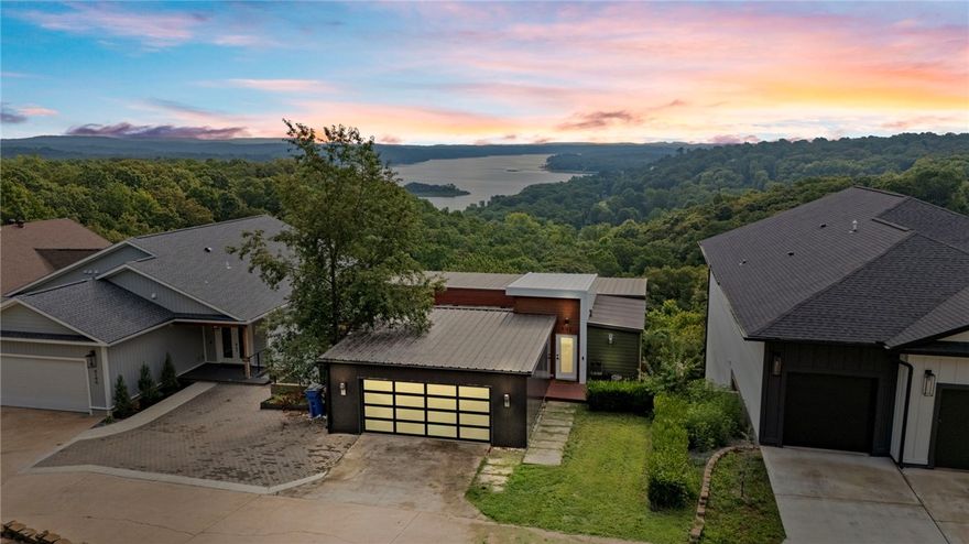 Welcome to 9192 N Park Road, where modern living meets breathtaking views! This updated, three-story home offers one of the best views on Beaver Lake, and sits just minutes from Prairie Creek Marina. The open floor plan is bathed in natural light, with expansive windows framing the stunning scenery. Thoughtfully upgraded throughout, this home blends contemporary style with ultimate comfort. Enjoy peaceful moments on the spacious deck or gather in the sleek kitchen designed for entertaining. With its prime location, spectacular surroundings, and views from every room, this property offers a lifestyle of lakeside luxury. Don’t miss your chance to make it yours!