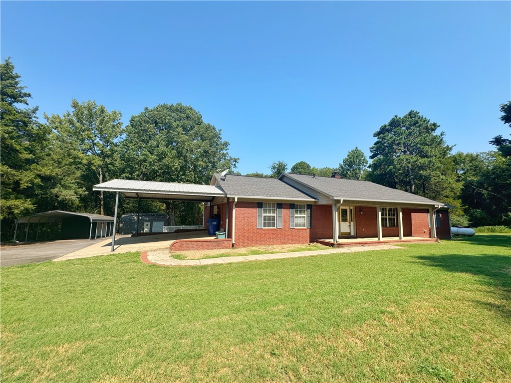 Well-maintained 4BR, 2BA brick home on 1.91 acres with a split floor plan, granite countertops, and a wood-burning fireplace. The oversized bedroom could serve as a second living room or be converted to a private mother-in-law suite. Enjoy a fenced backyard with an above-ground pool, two storage buildings with electric, and two carports. A Generac backup generator offers peace of mind, while natural light fills the home. All the charmāwithout the big price tag.