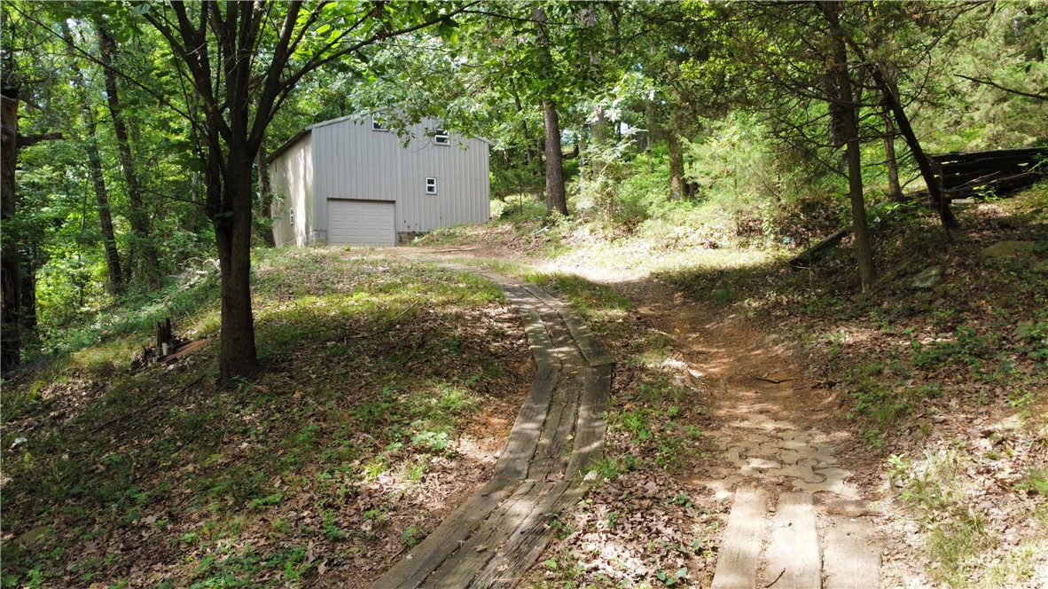 Tucked away in a peaceful, secluded setting surrounded by mature trees, this one-of-a-kind property offers the perfect blend of privacy, potential, and charm. Featuring a cozy studio apartment with an attached garage, this space is ideal for full-time living, a weekend getaway, or even a creative renovation project.
Enjoy beautiful seasonal views from your own private retreat and let your imagination run wild with the possibilities. Whether youāre looking to move right in or update it to reflect your personal style, this property is a rare find that invites you to make it your own.
Seclusion, nature, and opportunity, this gem has it all!