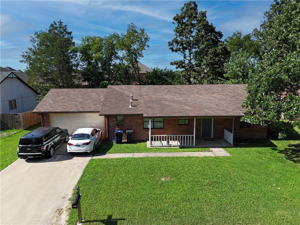 Excellent location near schools, shopping, hospital, trails, NWACC, and the Walmart Home Office.
This spacious all-brick home, is ideally situated in the heart of Rogers, just minutes from parks and downtown attractions. A canopy of mature oak trees provides shade and charm to the generous backyard, creating a peaceful retreat for relaxing or entertaining.
Inside, the split-bedroom floor plan offers privacy and functionality, with a large living area that opens to the back patio, perfect for outdoor gatherings. The kitchen includes ample cabinet space and a casual dining area for everyday convenience.
A newer TRANE HVAC system (installed in 2021) keeps the home comfortable throughout the year. Additional features include a roomy two-car garage and a covered front porch, great for enjoying quiet mornings or evening sunsets.