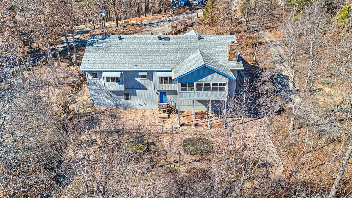 LAKE FRONT PROPERTY - LAKE NORWOOD. Lake access and lake view as well as the wooded surroundings are a highlight! Located on an oversized lot in a cul de sac conveniently located to Hwy 71, golf courses, restaurants, shopping and more! The interior has a very large living space, split floor plan with a stone propane fireplace in the living room, a lovely sunroom, dining room and a spacious eat-in kitchen with a island and a built-in china cabinet. The full basement is walk-out with tons of storage space and potential to make it whatever you want!