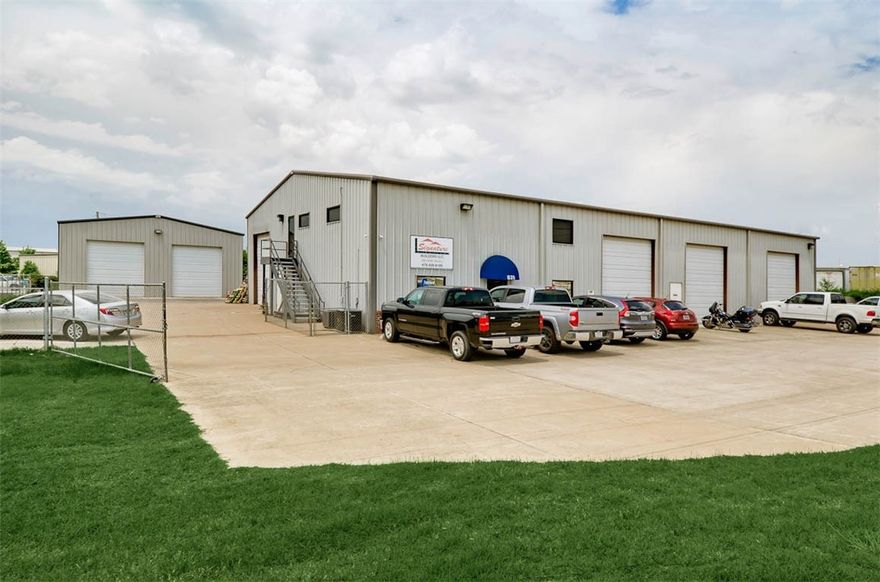 Very nice remodeled office space.  3 private offices, 2 conference rooms, kitchen, cubicle office space and 3 baths. Real oak flooring, central vac, security system.  One attached warehouse-5000 soft.  One detached metal building -3200 sqft built in 2012.  14' tall 12' wide over head doors.  17' ceiling. In ground tornado shelter. Upstairs office also has additional external access from front of building.