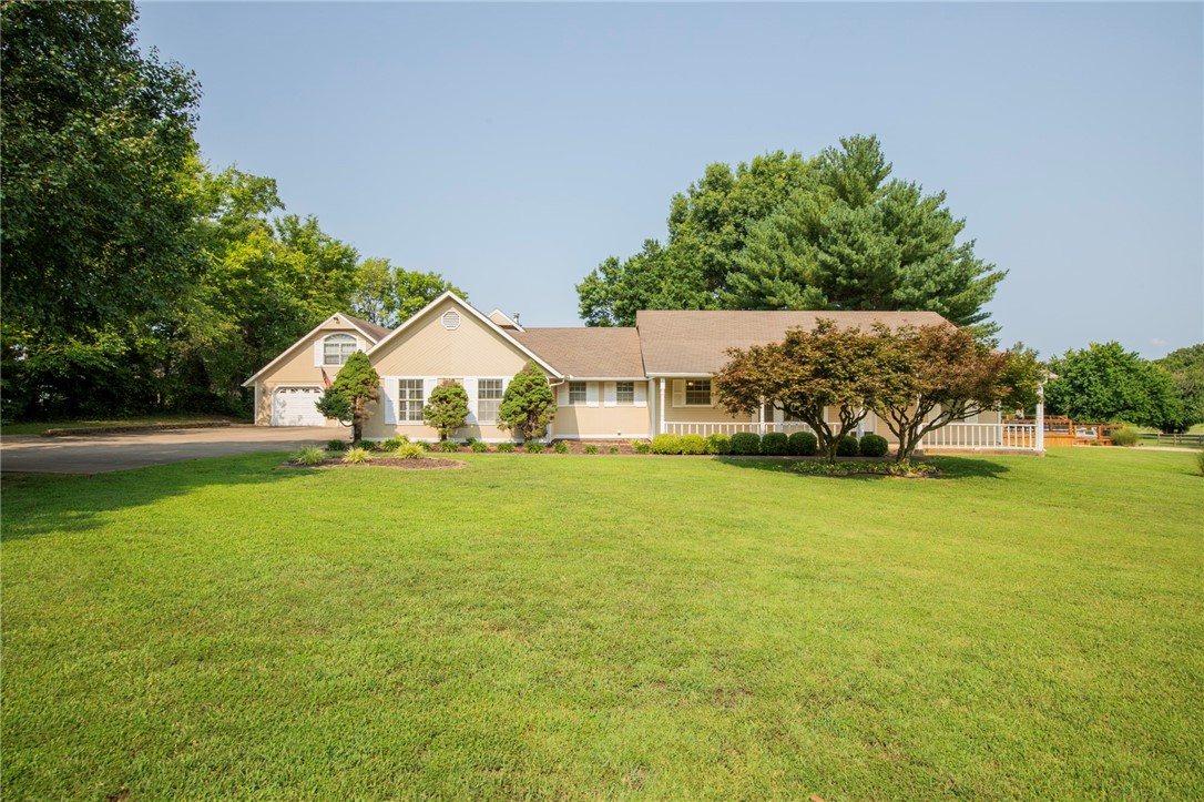 Location Location Location!! Located less than 1 mile from Coler Mountain trailhead and less than 1.5 miles from Bentonville Square. All with the elbow room .9 acres. 3313sf includes 2 living areas, 2 kitchens, 3 bedrooms and a bonus room. 4 car tandem garage features all the room you need to park your cars and work on your bikes! Incredibly unique opportunity for a large home and huge lot near Downtown and Trails!