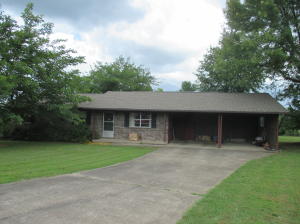 This 3 bedroom,1 1/2 bath brick home just outside of town, sets on 1 acre, paved road and screened patio, covered deck and much ,much ,more. Make an appointment to see this home today!