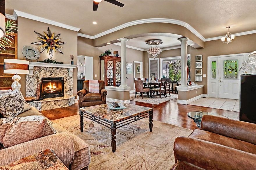 Quality-built with timeless OAK construction and a recently updated interior, this home blends craftsmanship with modern comfort. The open kitchen features a large island, pantry, and oversized appliance cabinet, flowing seamlessly into the hearth room with floor-to-ceiling windows for abundant natural light. Ideal for entertaining, enjoy a formal dining room and spacious living area, plus a private office just off the kitchen. The large primary suite offers a tray ceiling with rope lighting, and a bath with double sinks, vanity area, and a walk-in tower shower. A half bath and laundry are conveniently located nearby. The lower level includes spacious bedrooms, a great room with patio access, and a hobby room with exterior doors. Relax on the updated composite deck. Conveniently located near I-49, trails, golf, tennis, and pools. See attached amenities and updates list.