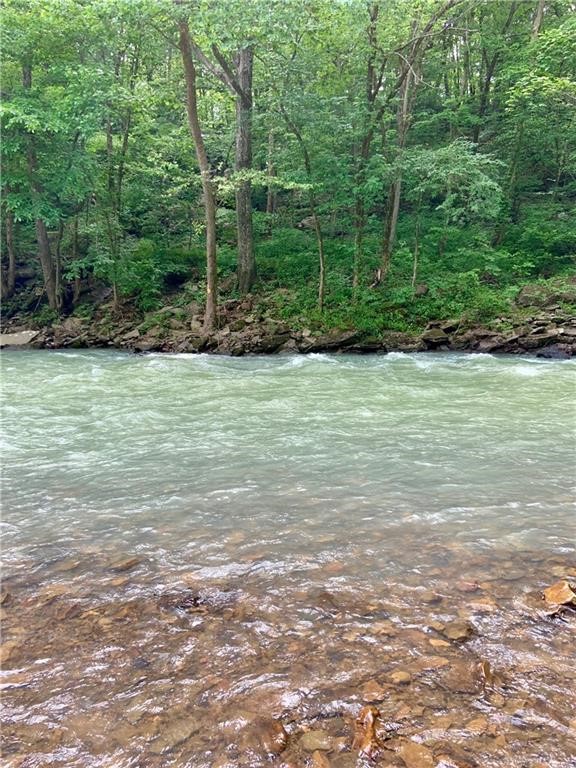White River frontage! The opportunity to own 25+/- acres on the White River is here! A lot of space to pick the perfect spot for your home, cabins, or hobby farm. If you are dreaming of owning a secluded Riverfront property this is it! The perfect getaway spot with 1500 feet of private White River frontage. Just 30 minutes from Fayetteville, it's the ideal place to unwind and leave the stress behind. Wake up and toss your kayak right in, fish from your own property, or a ride-in, ride-out OHV location for Mill Creek, White Rock, Frog Bayou and Mulberry OHV trails just minutes away. Would be a great hunting, fishing, or OHV camp. This property is whatever you want to make it. The beauty of Arkansas is right here. Sit on your property and listen to the river and enjoy the peace of owning your own paradise. Some wooded areas allow for a lot of wildlife to make this area their home.