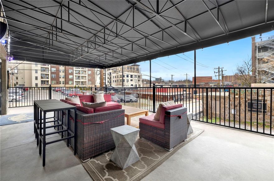 You will be wowed! 1 Block from U of A campus! Razorback fans and entertainers - this is your chance to own a true gem of Downtown Dickson Street area history! Ice House Condo 204 boasts absolutely stunning, bright and open living, kitchen, and dining areas. Huge outdoor entertaining patio shaded by an elegant black canopy where you can host watch parties on the drop down screen (projector ready). Back inside you and your guests will be captivated by the indulgent and modern surroundings featuring: exotic granite counters, solid wood bamboo floors, gorgeous furnishings and highly functional and customized built-ins throughout. High end Monogram appliances in kitchen. When you want to hit the town, you are less than a block from Dickson street, walking distance to EVERYTHING! Walton Arts Center, New cultural center, restaurants, entertainment, shopping, and much more! Bose whole home theater system throughout and on the patio. Gas fireplace with remote control. Razorback Greenway adjacent.