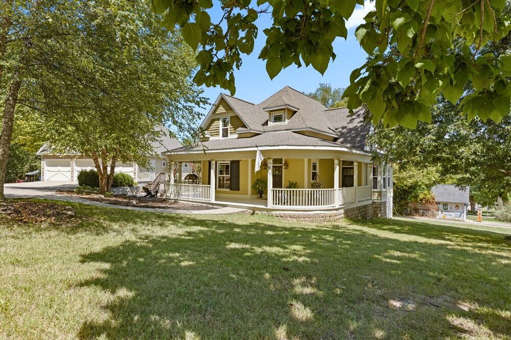 Discover timeless elegance in this completely remodeled historic property in Harrison, AR. This exceptional offering features two distinct living structures with a total of 7 bedrooms and 4 bathrooms, boasting a combined living space of 3,600 sq ft. The main residence exudes character with meticulously preserved architectural details, complemented by a luxurious kitchen equipped with top-of-the-line appliances, solid surface countertops, custom cabinetry and contains 2430 sq feet with 4 bedrooms and 3 full baths. Step outside to a large wrap-around porch, ideal for enjoying the serene surroundings. The property also includes a four-car garage, providing ample space for vehicles and storage. Every corner of this home showcases impeccable attention to detail,