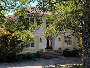This beautiful custom built home is situated on two lots with views from all three floors. Main level features living with open kitchen, dining, and fireplace. The upper level contains the master suite with fireplace and panoramic views. Lower level features two bedrooms, bath, and wet bar with access to the covered porch, patio, and a 75 foot lap pool. Custom fencing with multiple areas to entertain.