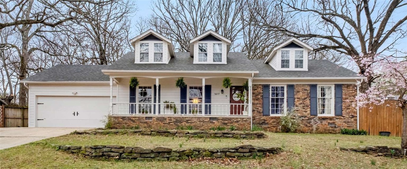 Classic Fayetteville charm with modern amenities awaits. Turnkey 4 bd/3 ba home situated on almost .5 acre in a wooded enclave. Be in the middle of it all while feeling miles away. Bought in 2018 and intended as a forever home. Added new wood flooring and refinished original wood flooring in downstairs common areas. Renovated kitchen and dining area in 2022. New deck and side yard overhaul in 2023. Upstairs primary bath renovated, wood siding re-sealed and painted, original downstairs windows refurbished and front door replaced in early 2025. Both HVAC units, roof, and water heater replaced in last 5 years. The updated kitch/dining area and adjacent living room are semi-open concept, designed with gatherings in mind. Down the hall you'll find a main floor primary with bath, 2 beds and another full bath. Upstairs is a cozy, private sanctuary with dormer alcoves and a wet bar, and a 4th BR with its own newly renovated full bath. With 2 options for primary, you can choose to be close to the other bedrooms or far away
