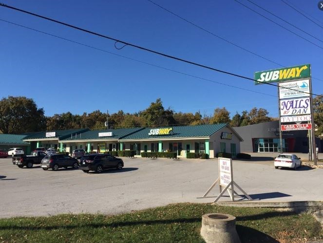 Huge potential income with this strip center located down the road from NWA Mall and across the street from Locomotion Fun Park. Income producing