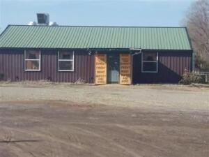 Metal building with parking lot just off I-40 Exit. Has a new trussed and metal with good pitch roof, good design. Has a large BBQ cooker and walk-in freezer that are negotiable. Was a restaurant and had a liquor licenses at one time. Building would be ideal to convert into a duplex also.