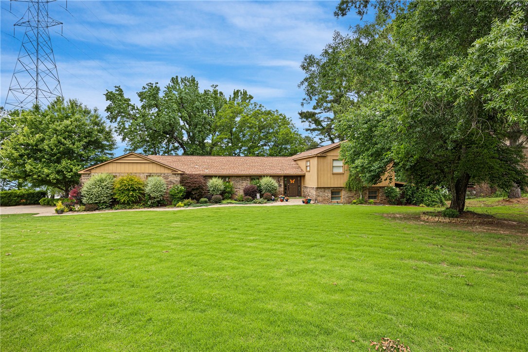 Welcome to your dream home by the lake! This exquisite 3-bedroom, 4-bathroom residence offers breathtaking water views, ample space for family & entertaining, and the ultimate lakeside lifestyle. Nestled on a serene lot with direct access to the lake, this property boasts two private boat slips, making it ideal for water enthusiasts. Whether you're boating, fishing, or just enjoying the peaceful surroundings, this home provides the perfect retreat on Lake Dardanelle! Key Features include a spacious floor plan with three living areas & large windows to take in the stunning views. Large Decks, perfect for entertaining, dining al fresco, or simply relaxing while soaking in the lakefront atmosphere. Whether you're hosting a sunset dinner or enjoying a quiet morning, you'll never want to leave
