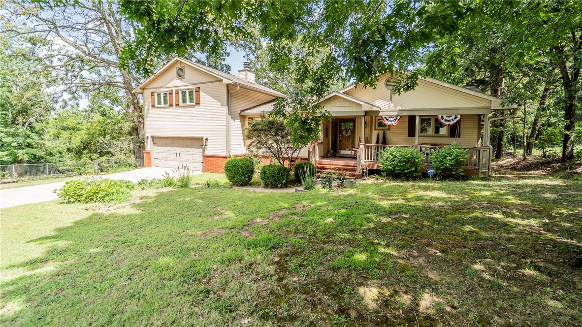 Tucked away in town but offering the kind of privacy youād expect from the country, this charming 5-bedroom, 2-bath home is just what you are looking for. Set against a backdrop of natural cliffs where no one can build behind you, the shady backyard feels like your own private retreat, complete with mature trees, a peaceful back porch, and a gazebo perfect for relaxing or entertaining.
Step inside to discover rich wood floors, custom cabinets, built-in bookcases, and beautiful solid wood doors that add warmth and character throughout. The spacious deck is ideal for sipping your morning coffee in the cool air or spending time with family in the evenings. A hot tub just off the deck conveys with the home, making it even easier to enjoy your private oasis.
With all the charm of a tucked-away hideout and the convenience of being just minutes from schools, shopping, and local amenities, this property truly offers the best of both worlds.