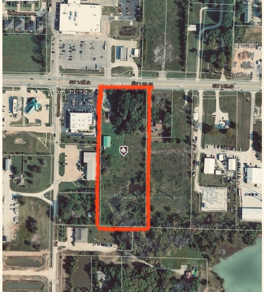 Check out this Great location, across from Neighborhood market and next to Starbucks! 5 Acres located on Hwy 102 with 266 foot of Hwy frontage. Value in the land and shop.  40 X 60 shop. City water but also well on site. Currently residential but could be made commercial. Still Rural according to county records. NO value to house. Property has not been annexed into city so there are many options for this property.