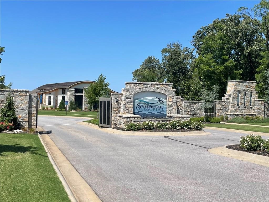 One of the last executive lots in Scissortail Community! This 0.65 acre lot has the potential for a walkout basement with one of the eight exclusive builders to create your dream home. Mature trees with a gorgeous Oak tree. Community offers Clubhouse, Playground, Sports Court, Family Pool, and Adult Pool.