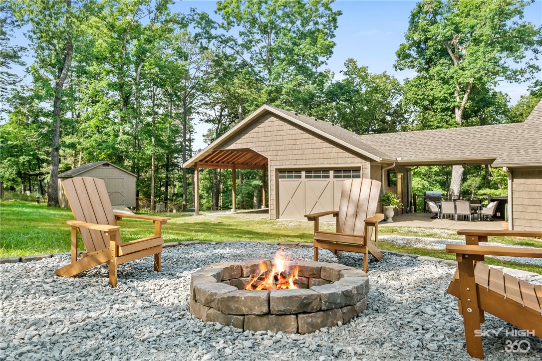A wonderful Beaver Lake area wood cabin that comfortably sleeps 8 people and is only 10 minutes from downtown Rogers. As a Short-Term Rental this cabin had grossed 60k a year for multiple years in a row. Open floor plan, hot tub, fire pit and 3 covered parking spots (space for a boat) are just some of the great features of this property. If not used as an STR, this property could also be a guest house to the main property at 8775 Falls Hollow next door. All showings must be scheduled between bookings.