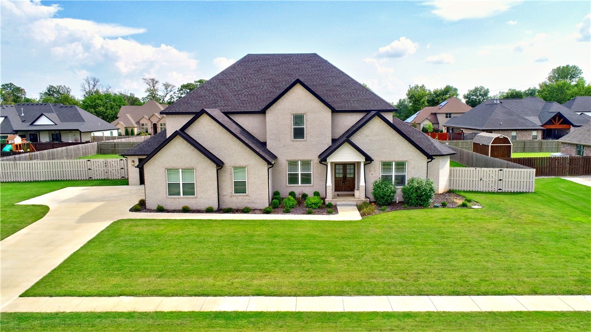 This beautiful one owner home will not disappoint! From the moment you step into the 2 story foyer, you are greeted by light open spaces and a floor plan perfect for entertaining. The spacious kitchen with a large walk-in pantry and quartz countertops is every home chef's dream. Open to the great room and a spacious breakfast area, there's also access to the covered patio with built-in fireplace. With fall coming, this is the perfect opportunity for indoors and out to serve as one large space to enjoy friends and family. The main floor also features a perfect primary suite with spa like bath and spacious walk-in closet. Upstairs are 4 more bedrooms - one is ensuite, plus a bonus room. There's also plenty of storage for everyone. Located close to Elmdale Lake known for great fishing, shopping, dining, entertainment and more.