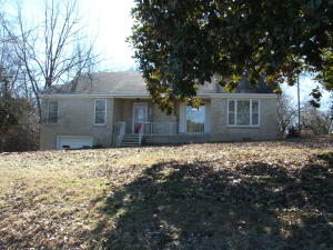 Nice older brick home with hardwood floors throughout. Home insulated and sheet rock added a few years ago. Has wood burning fireplace with has line so could have gas log. (Has had gas log), corner lot. Garage in basement, as well as plenty of storage. Home shows well. Selling 'as is'. Owners installing new central air & hot water heater.