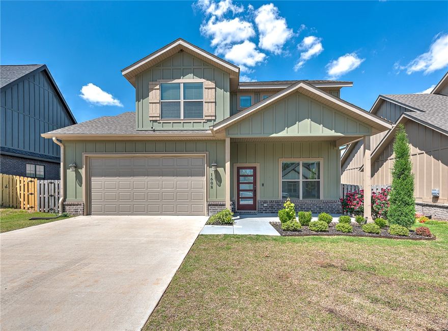 Discover the perfect blend of style, space, and convenience in this like-new modern home, ideally located in a newer Rogers neighborhood just minutes from downtown, top-rated schools, shopping, dining, and the Rogers Aquatic Center. Step inside to find a private front office with elegant French doors, a gourmet kitchen equipped with Frigidaire appliances, and an oversized walk-in pantry sure to impress any home chef. The main level also features a spacious mudroom, large utility room, and an additional laundry hookup upstairs for added flexibility. Upstairs, enjoy a versatile landing area complete with a built-in desk—perfect for homework, remote work, or creative projects. Outside, relax on the covered patio with ceiling fan, enjoy added privacy with an 8-foot fence along the back, and keep everything tidy with an irrigation system and dedicated storage building. This home is thoughtfully designed for modern living—don’t miss the opportunity to make it yours!