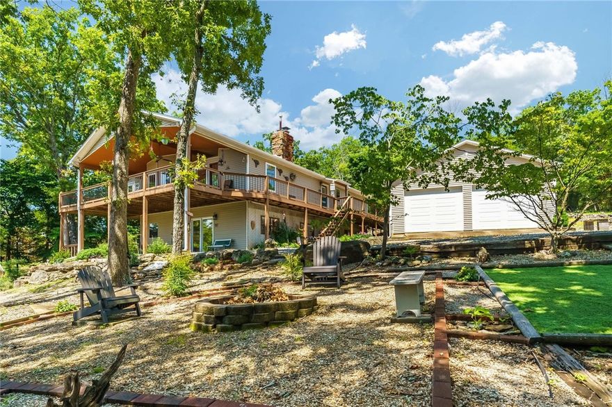 Priced under recent appraisal and first time on market. They built it, lived it, and loved it, this 3,218 sqft one-owner lakefront home is packed with everything lake life should be about. From the moment you arrive, you’ll feel the calm, the care, the way the home opens up with lake views, multiple living spaces, a large sunroom, 3 bedrooms, 2.5 baths, a bonus room for hobbies, fireplaces on both levels, and detached oversized garage for cars, tools, or lake toys—it’s all here! Upgrades make this more than move-in ready, newer composite decking, roof and flooring (4 years), new water heater, generator for essentials, low-maintenance, deer-resistant landscaping and even wheelchair accessible. Step outside and breathe in the reason you’re here, lake views from covered deck and patio and PRIVATE 2-slip dock with a swim platform. Airbnb is allowed, water only $150/year, only 30mins to downtown Rogers or Eureka Springs, 10mins to White River. This isn’t just a house. It’s where life slows down and moments last longer!