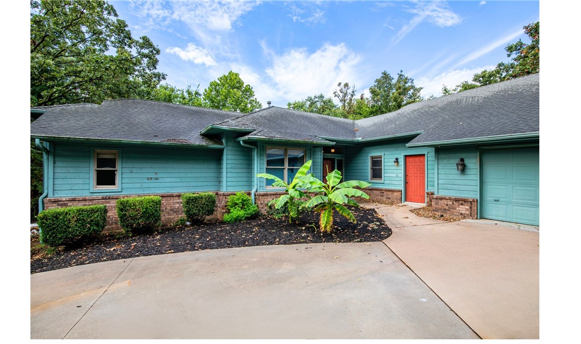 Discover your private retreat just under a mile from Coler Mountain Bike Preserve. Nestled on 2.21 wooded acres in the highly coveted Oak Hills community, this beautiful home and setting offers a serene escape with room to live, work, and entertain. Step outside to enjoy the expansive covered composite deck, in-ground pool, and screened-in hot tub—ideal for year-round gatherings. Inside, large windows fill the home with natural light and frame peaceful views of the surrounding trees. The executive office includes custom built-ins and overlooks the natural landscape, while the spacious walk-out basement offers flexible space for a home gym or recreation area. Multiple guest suites with private exterior entrances provide versatile hosting options, and a detached workshop with RV parking provides even more convenience. Come experience the potential this Oak Hills retreat has to offer!