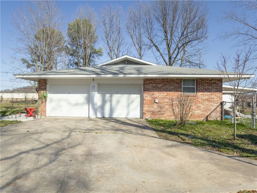 This 1.5-acre property, located near downtown Springdale, offers exceptional potential for future development. While currently zoned for agriculture, it is surrounded by industrial, commercial, and multifamily properties, making it an ideal candidate for redevelopment. The existing home on the site can be utilized for office space, with several sheds and outbuildings offering additional storage or workspace options. With its prime location and surrounding growth, this property provides a unique opportunity for businesses looking to expand or invest in the area. Recent upgrades include-2 new toilets and lines, new stove, new dishwasher, new sink and garbage disposal, new water line, new gas line, new 100 amp electric box. -All new upgrades within last 7 months.