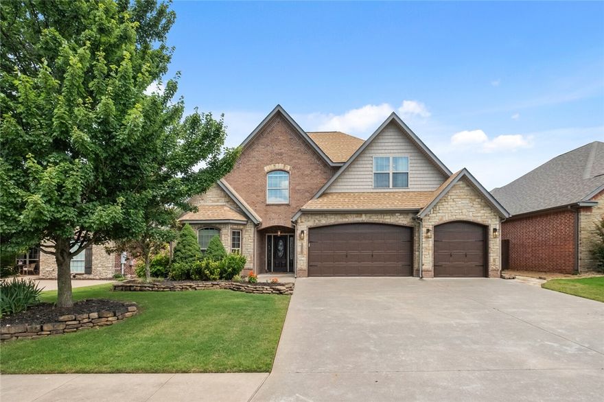 Welcome to your dream home in Oxford Ridge—featuring 4 bedrooms and 3 bathrooms! The open-concept layout is perfect for hosting guests or spending time with family. Enjoy the covered back porch and extended flagstone patio—ideal for grilling or relaxing. The spacious kitchen with large island and gas cooktop is the heart of the home—perfect for gathering and making memories.

The living room features soaring ceilings and a cozy corner fireplace. The formal dining room offers flexibility and could serve as a home office. Hardwood floors add warmth and elegance throughout, while built-in cubbies and laundry room storage keep things organized.

Upstairs are two bedrooms, a full bath, and a bonus room with wet bar, mini-fridge, and microwave—great for entertaining. Walk to the Bentonville Community Center and schools. New roof installed in 2023!