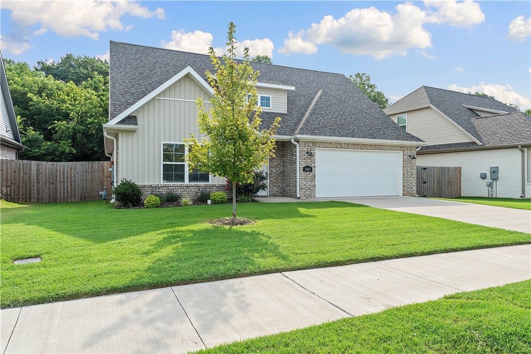 Welcome Home! This move-in ready 4-bedroom home with a dedicated office or dining room offers the perfect blend of privacy, space, and style. Built in 2022, this well-maintained home features more than 2,000 square feet of thoughtfully designed living space on a level lot and backs up to serene woods. Are you tired of looking at homes in the middle or a construction zone? With no room to build behind this home, you will always get to enjoy the peace, quiet, and natural views right from your backyard. The heart of the home is a spacious open-concept living area with a gas fireplace, perfect for cozy nights in. The main-floor primary suite provides convenience and comfort, while three additional bedrooms and a versatile office space offer plenty of room for family, guests, or working from home. All kitchen appliances and washer and dryer stay. Bentonville School District