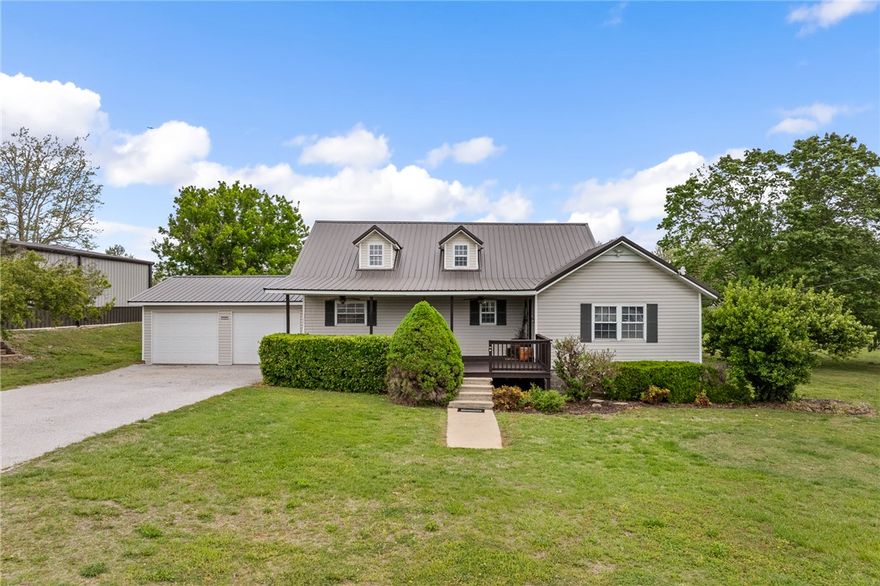 Conveniently located close to town yet offering a peaceful country feel, this well-maintained home delivers the best of both worlds. This 3 bed, 2 bath, and a spacious second family room, the layout provides plenty of room to spread out and enjoy. The kitchen stands out with oak cabinetry, engraved tile accents, and custom countertops, creating a warm and inviting space. The home also includes several valuable updates, including a newer metal roof, updated plumbing, and a 4-ton air conditioner. Sitting on a level one-acre, the property also boasts an impressive 40' x 50' Red Iron shop building a dream setup for anyone needing serious workspace. It’s wired for 240, built on a reinforced 6-inch slab designed for lifts and heavy vehicles, and features two front garage doors plus an 8' rear door positioned to catch a breeze. Clear epoxy floor makes cleanup effortless. This one-of-a-kind property truly has it all extra living space, a shop, quality craftsmanship, and a serene setting. Don’t miss your chance to see it.