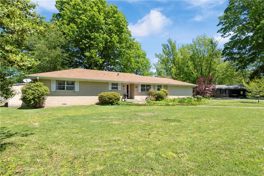 Back on market, not due to the property!  New roof, hot water heater, dishwasher, and fence!  Nestled in a tranquil neighborhood and conveniently located close to downtown Rogers, schools, parks, shopping, and dining options, this home offers the perfect blend of tranquility and convenience.  Charming two bedroom, two bathroom home on a corner lot.  The serene outdoor space is cozy and inviting.  Included is an attached shed for plenty of storage!