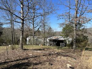 Here is an older 2 BR and 1 BA singlewide mobile on 5 wooded acres. This property is about 2 miles to the Buffalo National River Park and 3.5 miles to Johnny Morris new development at Dogpatch. Selling as is where is.