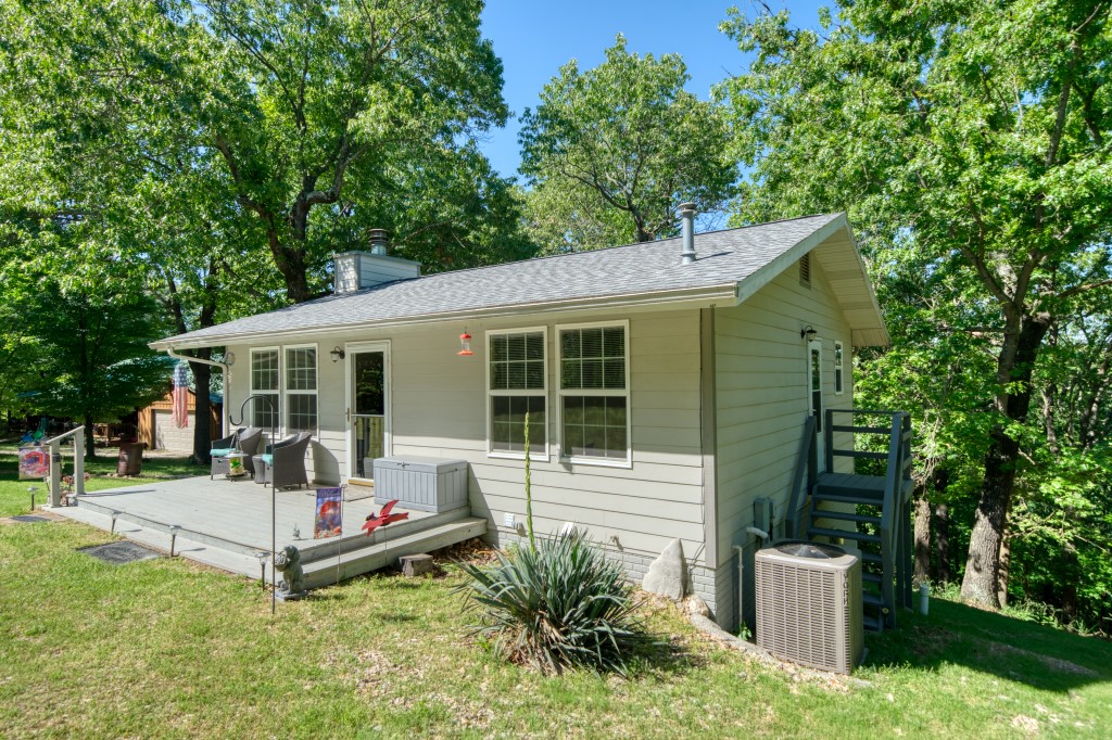 Check out this amazing package! A Beaver Lake cottage, 24ā community dock slip, pontoon boat, and side-by-side, all for a great price! Dock slips are difficult to find since new docks are not allowed on the lake, and this one is located in the same subdivision as the house. Hop in the side-by-side, drive to the dock, let the boat down off the lift, and youāre on the lake! This well-maintained home would be excellent for a small family or weekend getaways. The interior is super clean with one bedroom upstairs and one downstairs, each with their own bath. Two storage sheds (12x20 and 10x16) and a lot across the street are also part of the package. This home includes wood burning and gas fireplaces, a 2-car carport, a new roof in 2024, paved streets, and winter time lake views!