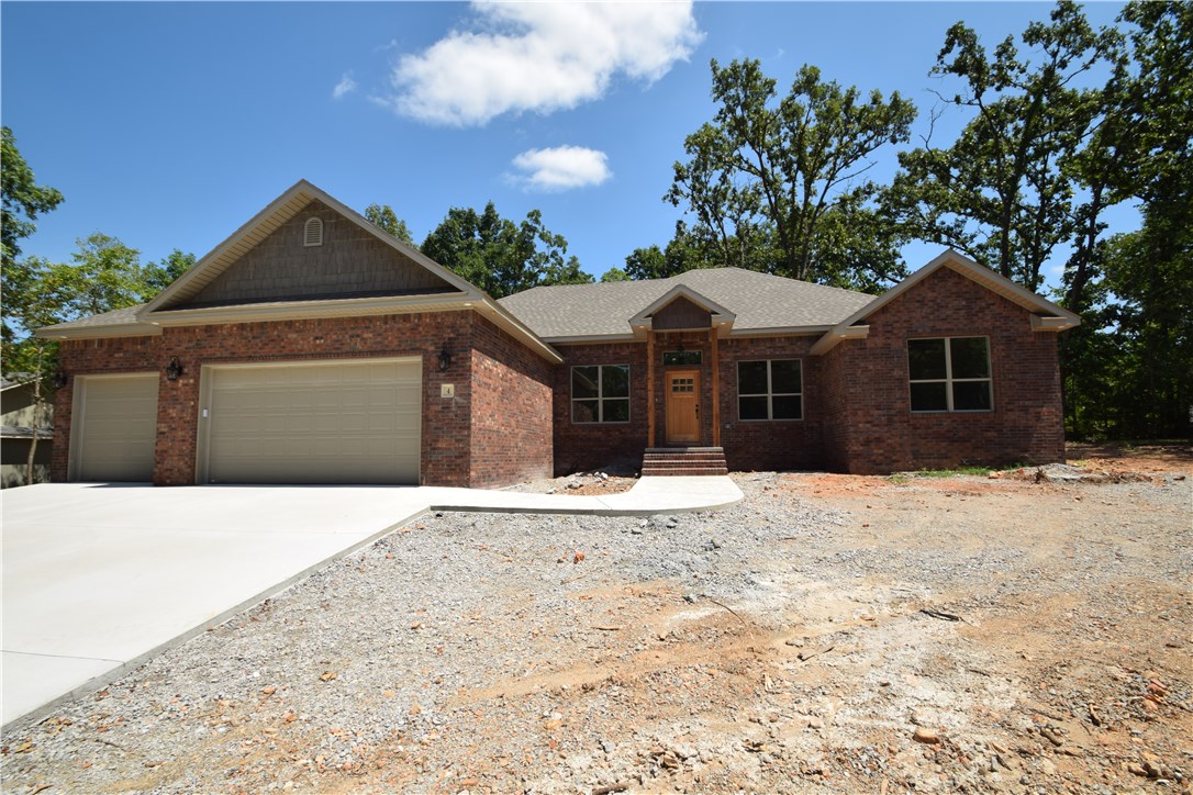 Almost complete! All brick home close to Metfield Golf course on Sewer with 3 car garage! Come enjoy Bella Vista w/4 bedrooms & 2 baths, as well as an office w/unique ceiling treatment & barn style doors. Home has tall ceilings & wood floors throughout main living space & formal dining room. Kitchen has custom cabinets,granite,pantry and eat in space. Master has huge walk-in tile shower and two walk-in closets.Home has mud room with extra closet for storage. Home has flat back yard w/covered patio. Bentonville Schools. Home was constructed with zip wall board, foam board, and low E windows.