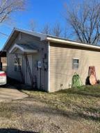 Cottage style home. This property is great for that starter family. This 2 bed 1 bath home is quaint & cozy!! Move in ready and priced to sell. This home has been well took care of. Nice sized bedrooms, living room, and functional kitchen area. Covered back patio. New fenced in back yard for your adorable pets. This is a great price for this property inside the Clarksville School District. Call today for your private showing. This property will not last long at this price!!!