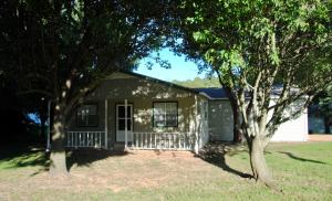 Neat clean home, updated and ready for new owners. New 2 car garage door, kitchen and bath cabinetry recently refinished. Home features a large kitchen island with storage, an open floor plan and an8 x 24 workshop attached to the garage.