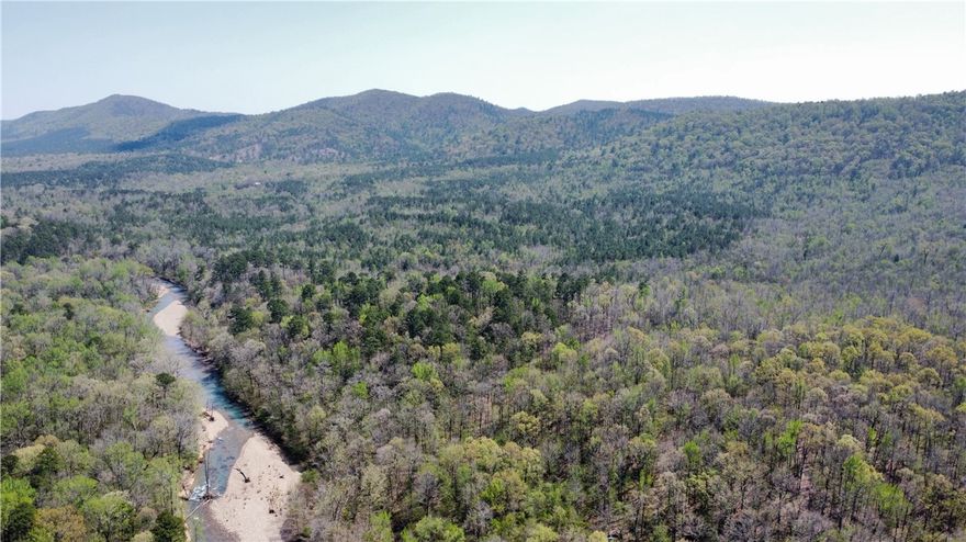 This 480-acre property in southern Montgomery County lies within the Ouachita National Forest, bordering the South Fork Caddo River. Featuring mixed pine/ hardwoods, with roughly 160 acres of planted pines ready to be thinned. The seller has selectively harvested timber to improve wildlife habitat. The terrain is mostly gently rolling, with over 2.5 miles of maintained roads and 1 mile of two-track trails that could be converted into quality roads. The property adjoins nearly 6,000 acres of largely inaccessible Ouachita National Forest to the south. Healthy populations of deer, bear, and turkey are present and would only continue to improve with more habitat improvements. The property also includes multiple spring-fed branches, over 100 yards of private river frontage, and 470 yards of landlocked public river access.