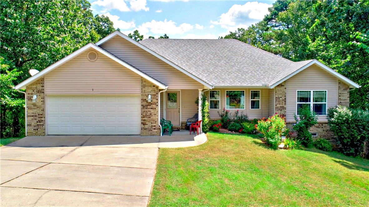 4th bedroom with 3rd full bathroom in walk-out basement. Accessible from outside- Great for In-law suite or Airbnb. Custom build home with original owners that has 3 bedrooms and 2 full baths on split bedroom plan on main level. Close to Lake Norwood on cul-de-sac street. Open Living-kitchen and dining plan allows you to entertain family and friends. Vaulted ceilings, fireplace, wood floors, open kitchen featuring plenty of counter & cabinet space Kitchen has a large island. Covered back patio to relax in shade during cool evenings. Patio looks out into private wood area and steps leading down to private in-law suite or Airbnb. Huge crawl space for plenty of storage or work/shop space. Well maintained home with new roof. Just 5 minutes form the lake or golf course. Easy access to 71B but plenty of privacy on quiet cul-de-sac street. Primary bedroom has dual sink countertop and fiberglass shower and walk-in closet. Utility room just of entry from garage and next to primary bedroom doorway.