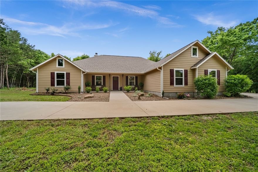 Built in 2022 and perfectly positioned on a level 1.12-acre lot atop Whitney Mountain, this stunning 4-bedroom, 3.5-bath home in Lost Bridge Village offers the ideal blend of modern comfort and lake community living. Designed with space and flexibility in mind, the home features two luxurious primary suites, making it perfect for guests or multi-generational living. Bright, oversized windows fill the home with natural light and showcase the peaceful setting. The open-concept layout flows beautifully for entertaining, while quality finishes and thoughtful design create a warm, inviting atmosphere throughout. Enjoy the amenities of Lost Bridge Village, including a community pool, pickleball courts, clubhouse, playground, and close driving access to Beaver Lake. Whether you're looking for a full-time residence or a lake-area retreat, this newer home offers the perfect combination of comfort, convenience, and community.