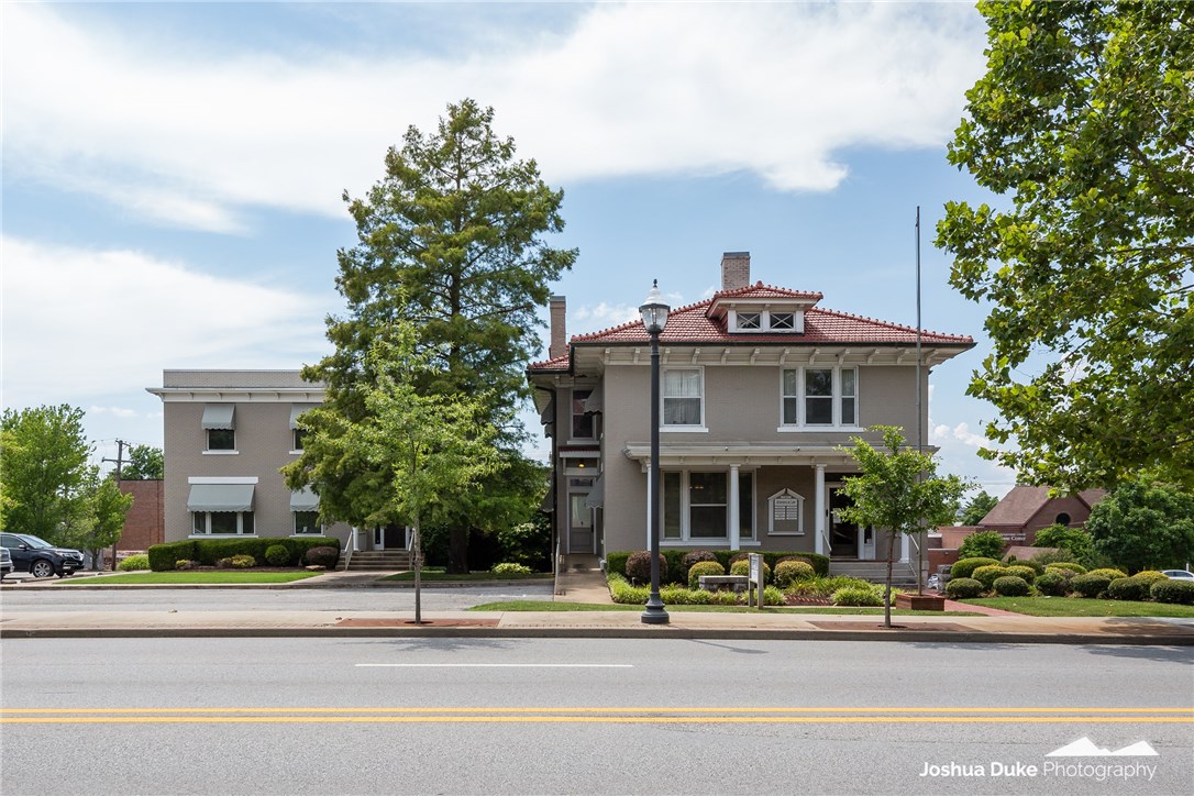 This 2 building office complex consists of an a completely restored, iconic Downtown Fayetteville building (221 N. College) constructed about 1900, plus an attached office structure built in 1993. The finishes are very professional. This original structure has approx.5,820 sf on 3 levels. It has separate HVAC units for each level, and retains many of the original woodwork and other features. The office building constructed in 1993 has 2 levels of offices, plus a finished 600 sf on a lower level for file storage & a total of 5,680 sf The building has separate HVAC units for the 2 main levels. Each building is separately metered for utilitiies. There is parking for approx. 33 vehicles on-site, and the landscaped areas are full sprinklered. The buildings can be separated, and the seller wishes to lease back the 221 building for a 3 yr term. This investment is unique in its location, parking capacity, and condition. It is move-in ready. More details can be found in the supplements.