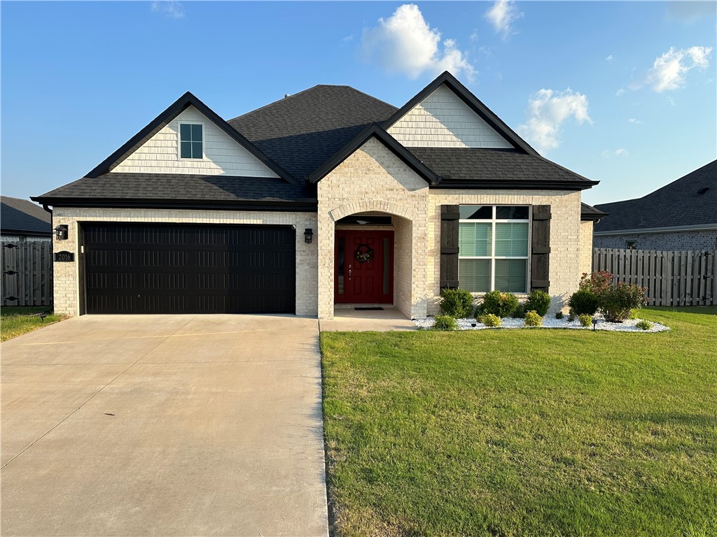 Discover the epitome of comfort and style at Chandler Run, where this 3-bedroom, 2-bathroom home awaits. Embrace elegance with hardwood floors in the living room and entryway, complemented by ceramic tile in the kitchen and breakfast nook. Granite countertops and stainless steel appliances, featuring a gas range. Enjoy spacious walk-in closets and unwind by the cozy gas log fireplace in the living room. Benefit from low e-windows. This meticulously crafted home embodies modern living in the heart of Northwest Arkansas.